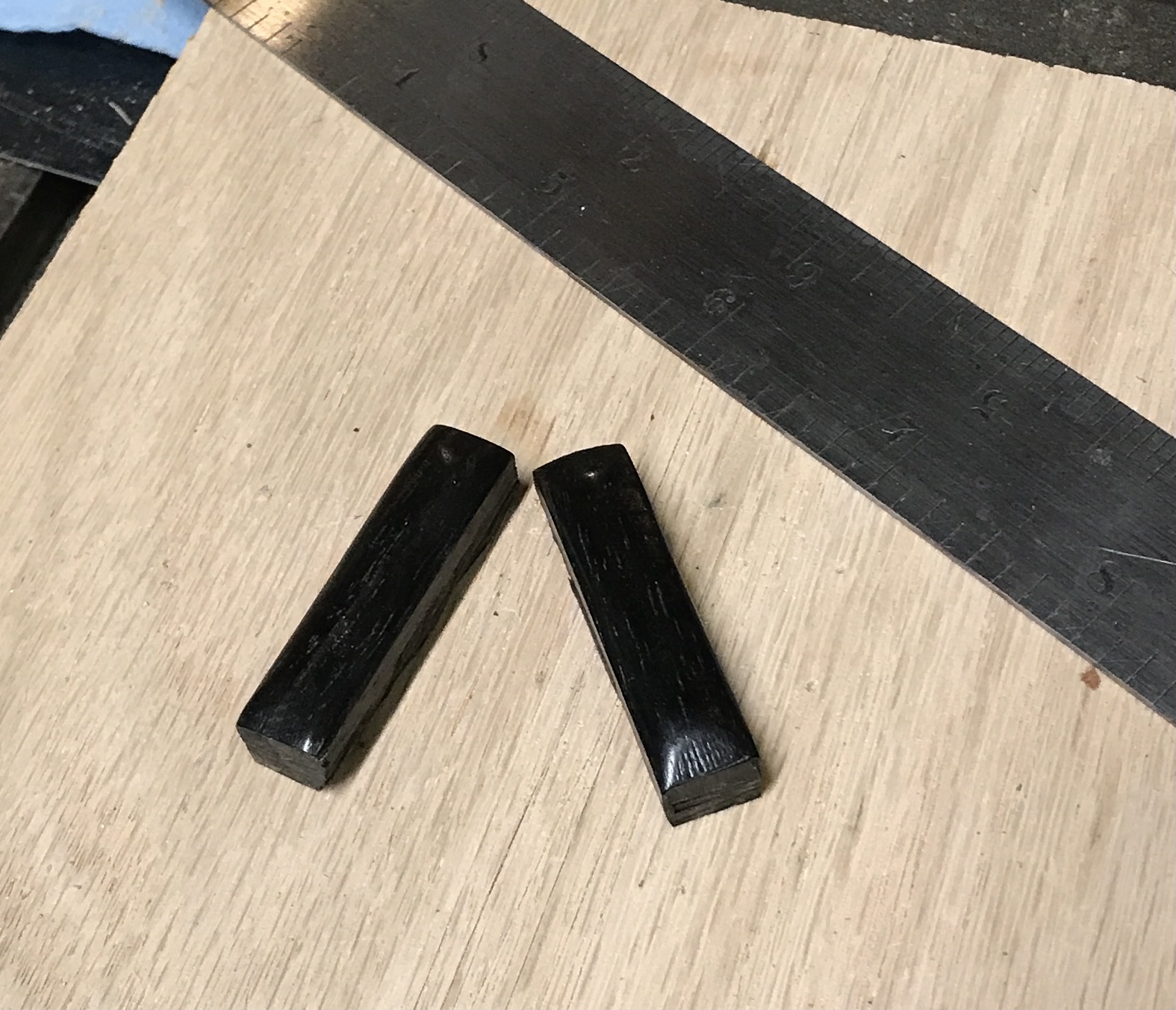 The two polished ebony long dots